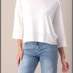 Camisola de malha fluida com detalhe perfurado